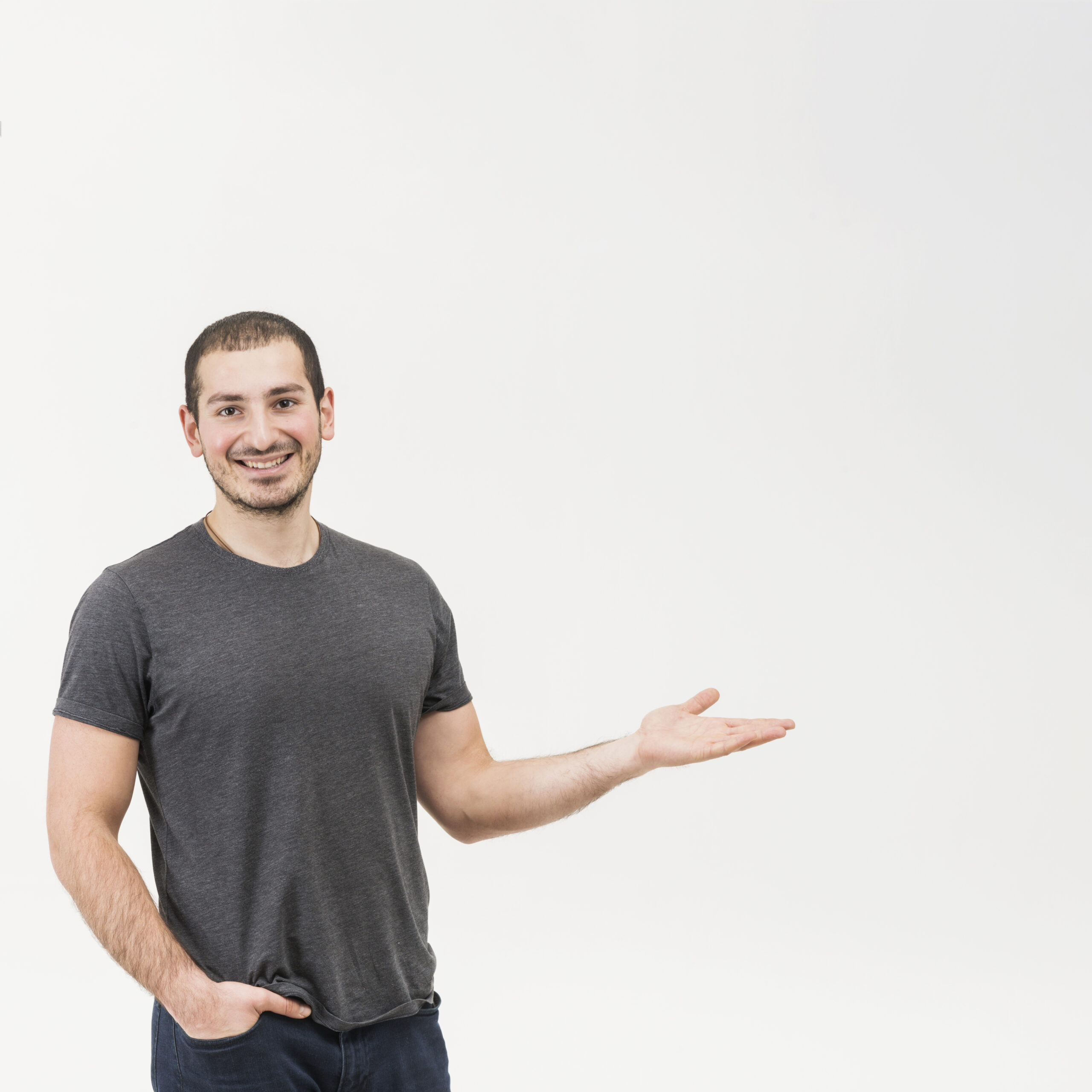 happy-young-man-presenting-white-background